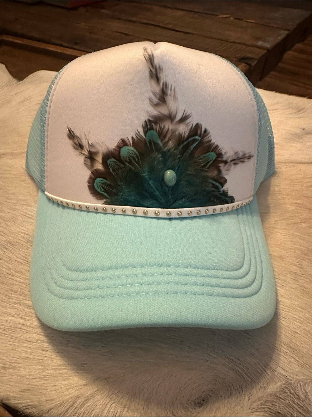 Turquoise Feather Graphic Trucker Hat